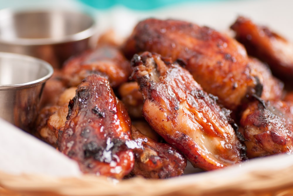 Dish of chicken wings flavored with maple syrup and spices